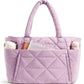 Close view of the diamond quilting and stitching on the padded nylon shoulder bag