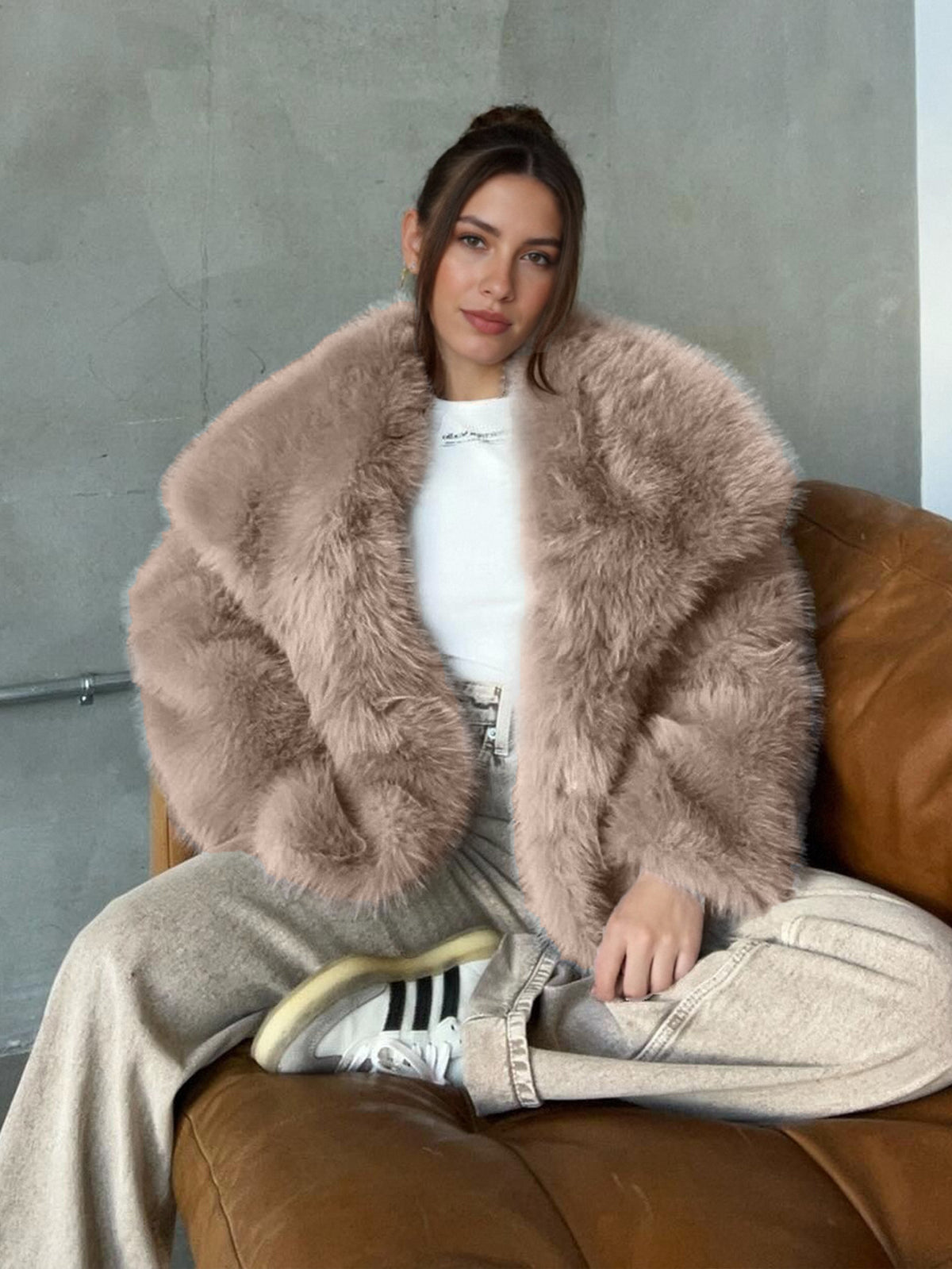Taupe vegan fur lapel jacket on a seated model with a white top, option Taupe, size XXXL