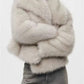 Soft faux fur cropped jacket with hidden side seam pockets and dense horizontal fur bands