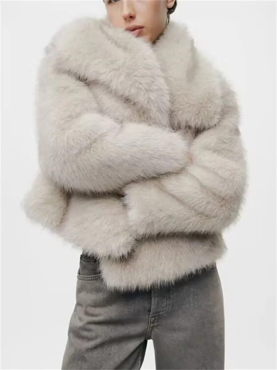 Soft faux fur cropped jacket with hidden side seam pockets and dense horizontal fur bands