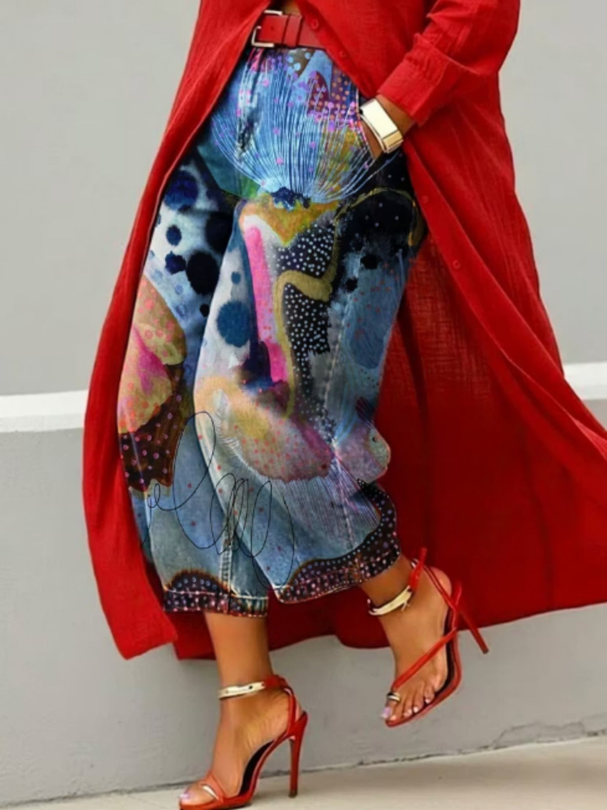 Wide leg cropped denim jeans with watercolor abstract and polka dot print, red coat and heels