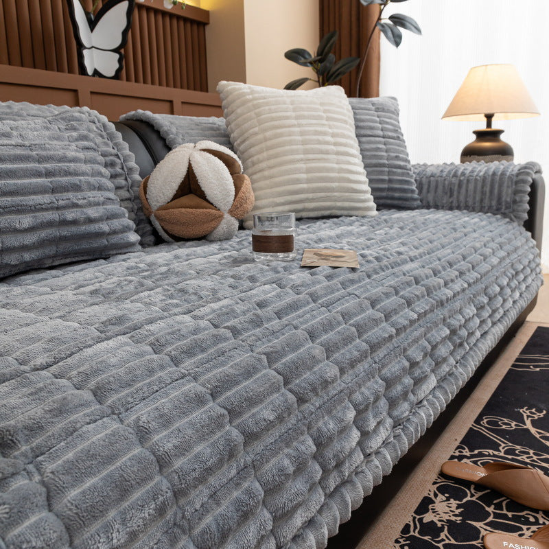 Winter Rhythm Light Gray ribbed plush sofa cover on a sofa, 90 x 160 cm