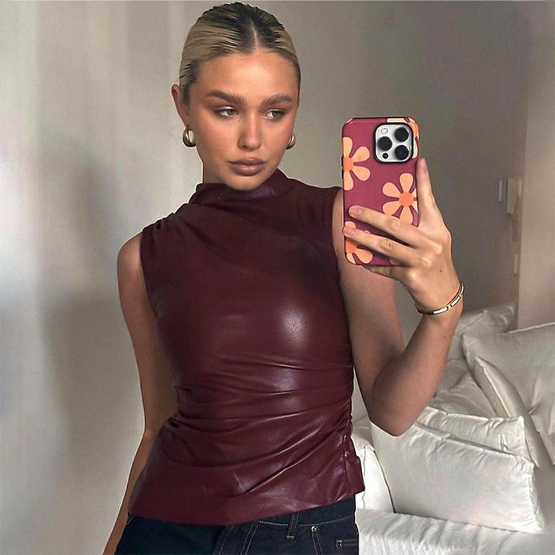 Material close-up of the supple matte faux leather on the sleeveless top