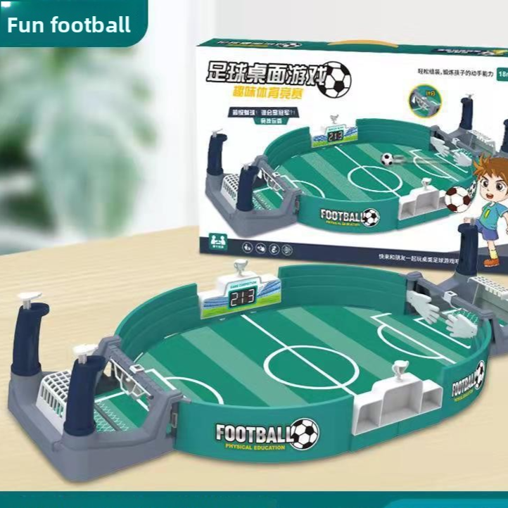 Green desktop football battle game with spring launchers and goals next to its box