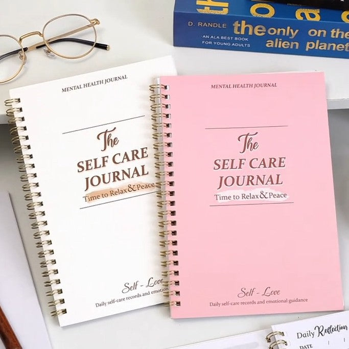 A5 Self-Care Diary Planner side profile showing the bound spine and page edges