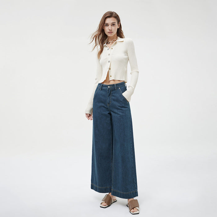Waistband detail with belt loops and brass button closure