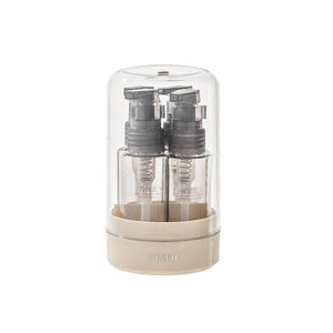 Four 35ml press pump and mist travel bottles in a round base