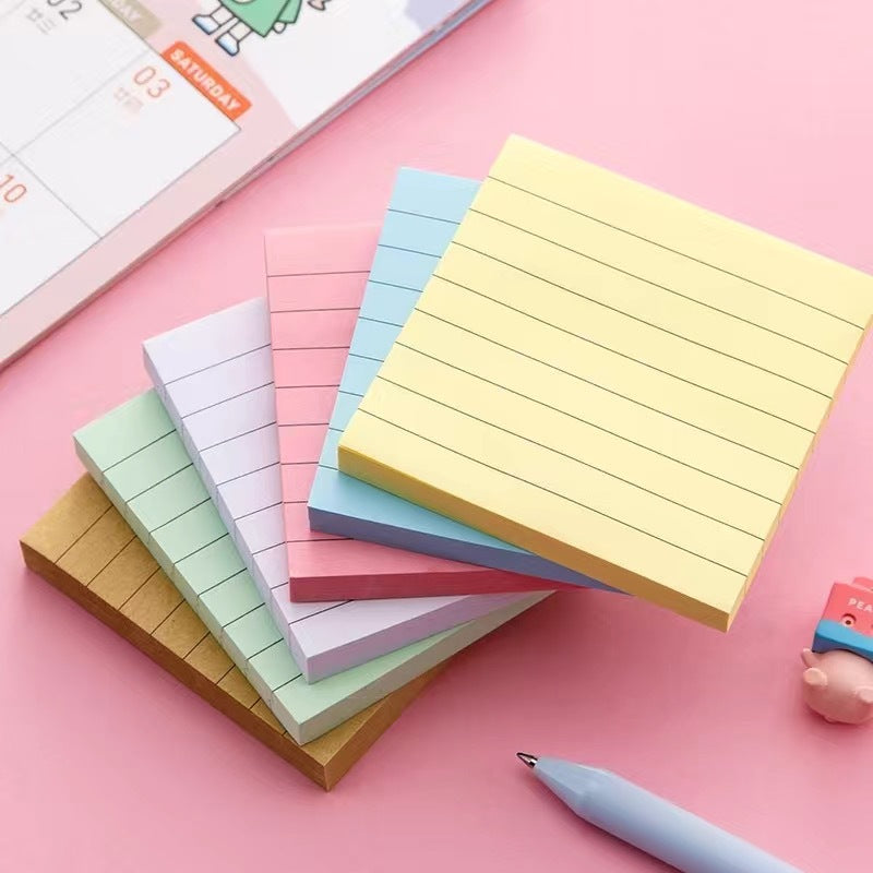 Fan of five pastel ruled sticky note pads in yellow, blue, pink, green and purple