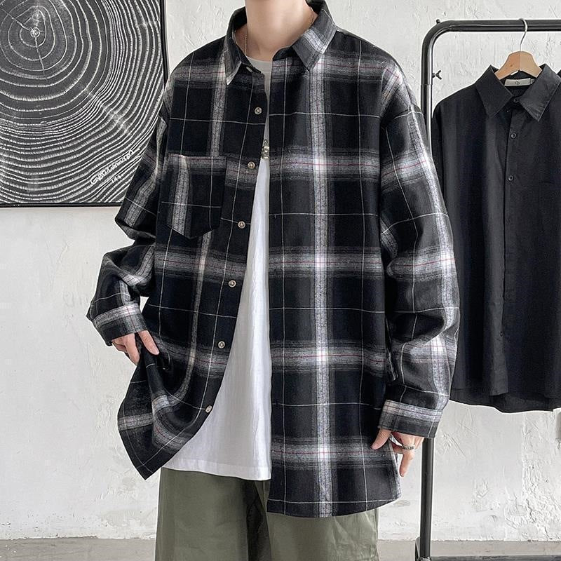 Black plaid long sleeve shirt front view worn open over a white tee
