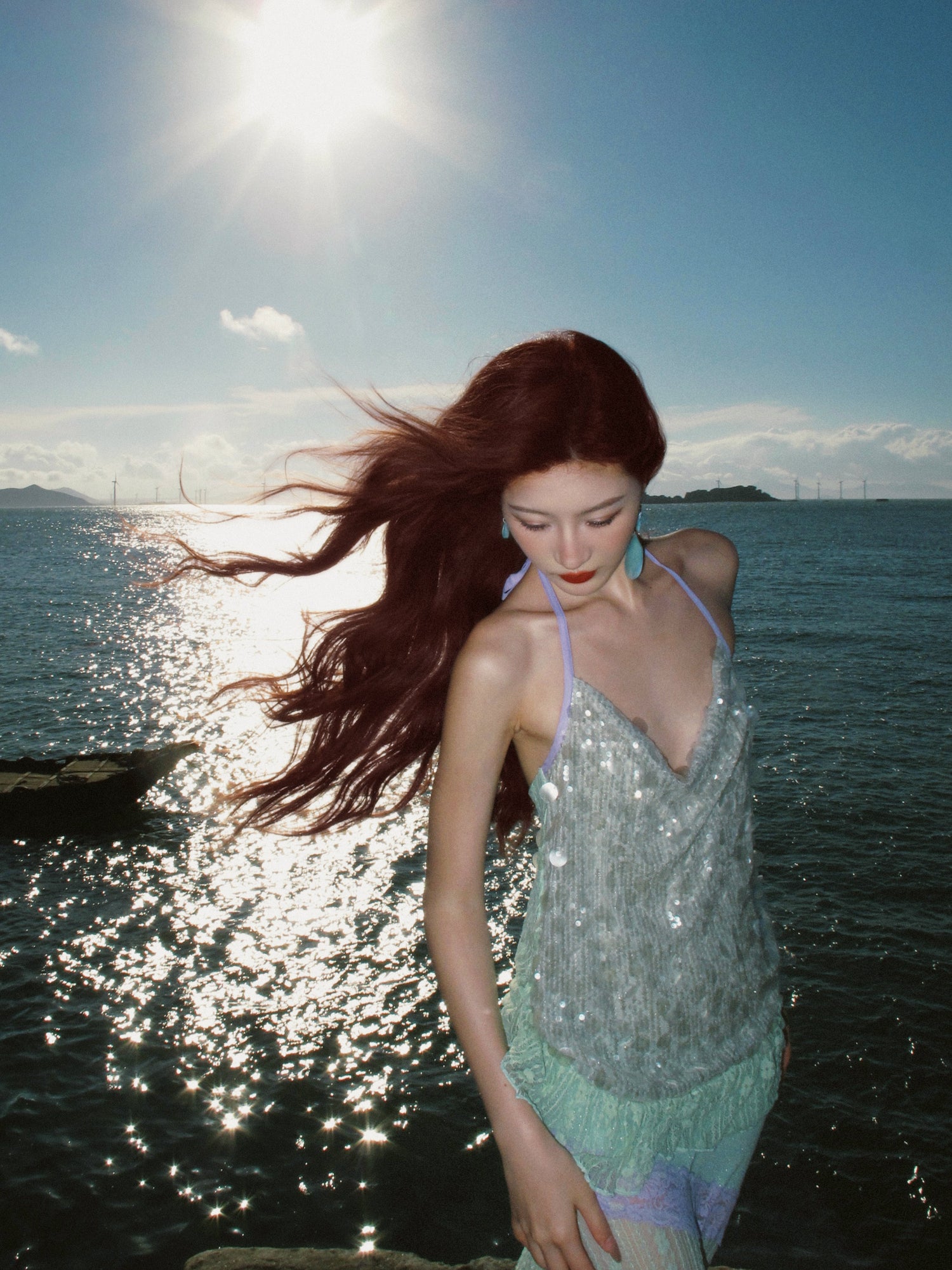 Sequin gown laid flat showing full silhouette and hem