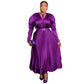 Purple high shine pleated maxi dress with tie neck and matching belt, worn front view