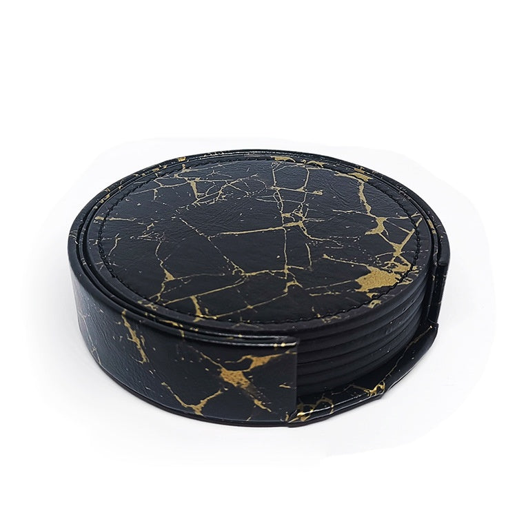 Black and gold marble PU leather round coasters stacked in a holder