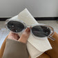 Clear frame retro oval sunglasses with dark gray lenses and a star detail, option Clear Frame