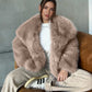 Taupe vegan fur lapel jacket on a seated model with a white top, option Taupe, size XS