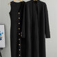 Black two piece ribbed knit set showing the buttoned dress beside the long open cardigan