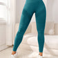 Womens yoga leggings with a wide high waistband and a scrunch back seam