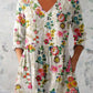 Bordered boho print tunic top shown full length on a model