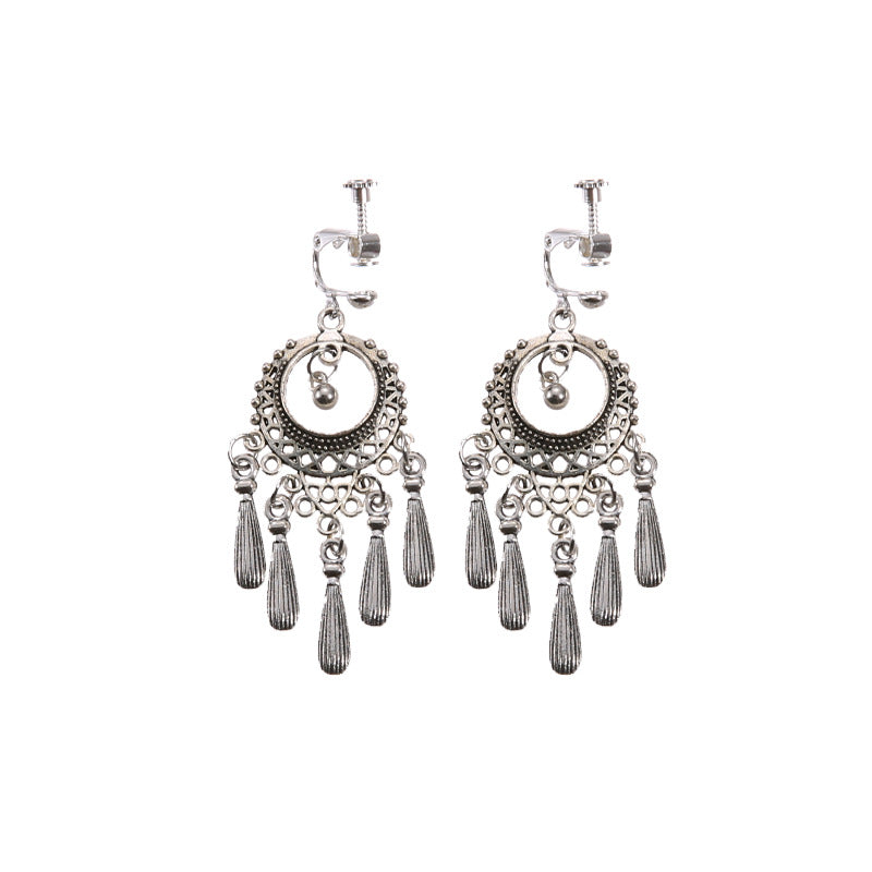 Bohemian tassel and bead clip-on drop earrings, aged tone zinc alloy frame, handmade pair on plain white background
