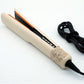 Open champagne hair straightener showing rose gold plate and row of control buttons