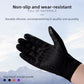 Black glove palm with silicone grip pattern and touchscreen fingertip against a snowy mountain sky