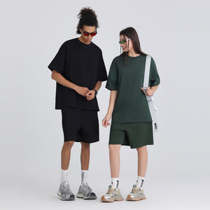 Model wearing the oversized heavyweight cotton crew neck tee with a relaxed drop shoulder cut