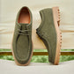 Men's green suede casual lace-up shoes front view showing the moccasin stitch toe