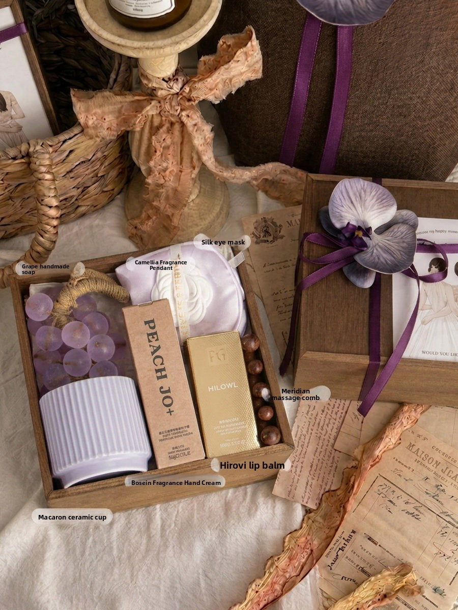 Monet Purple Filled Box option, wooden box laid out with labelled gifts beside a closed box with a purple ribbon