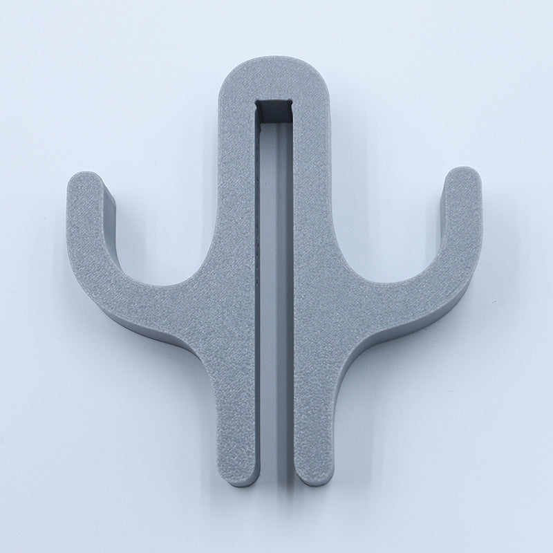 Gray resin double hook with an arm on each side, seen from the front on a light background