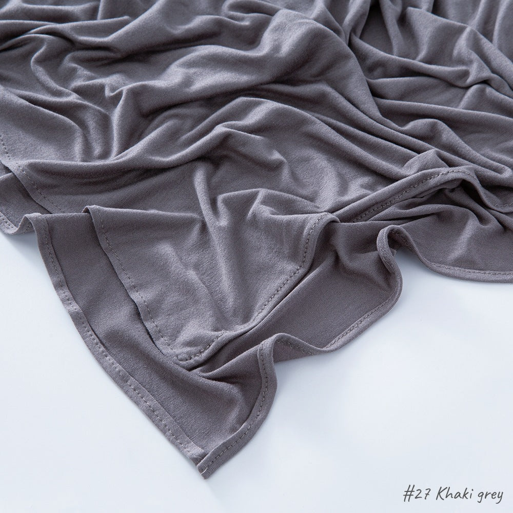 Modal cotton headscarf wrap draped to show length and the smooth fall of the breathable jersey knit