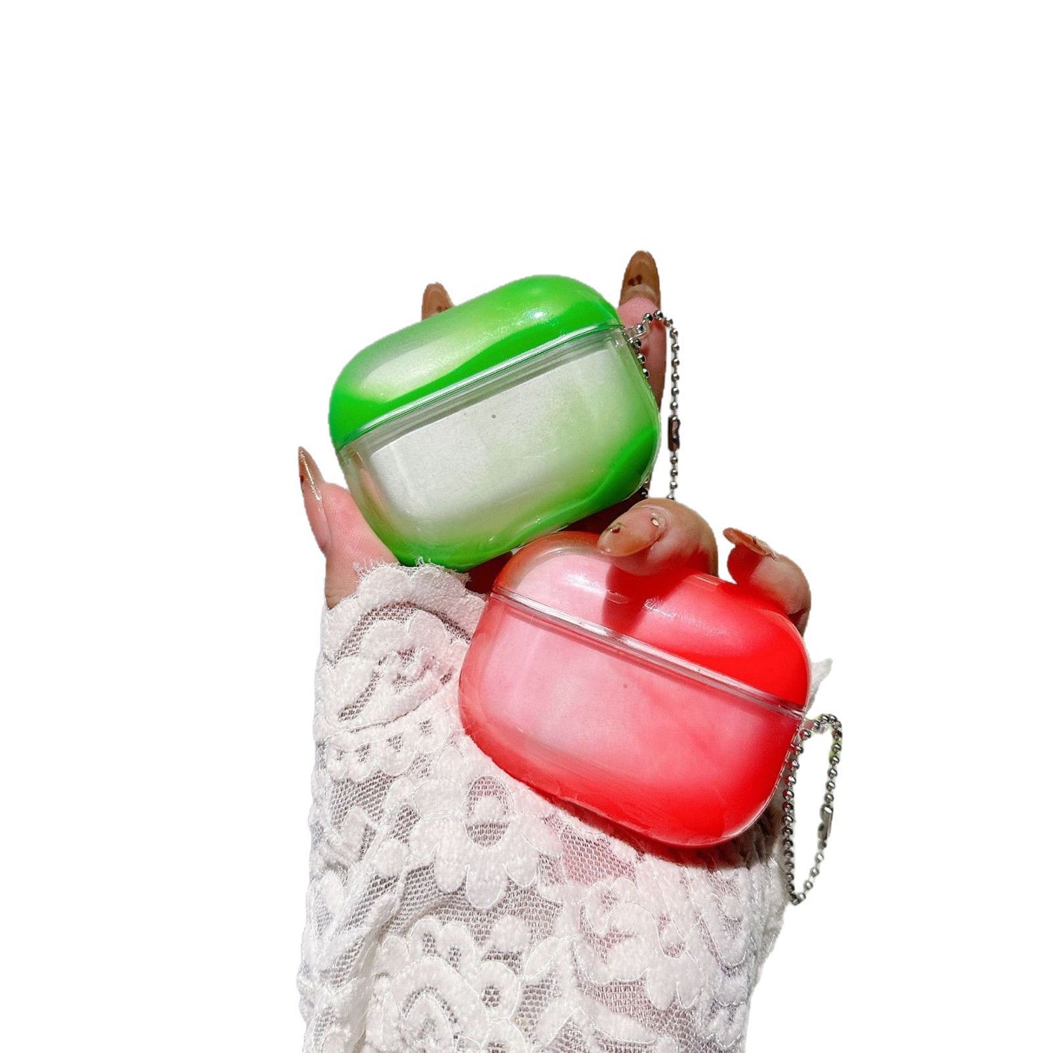 Clear marble AirPods protective cover case with a clip on ball chain on a pale table