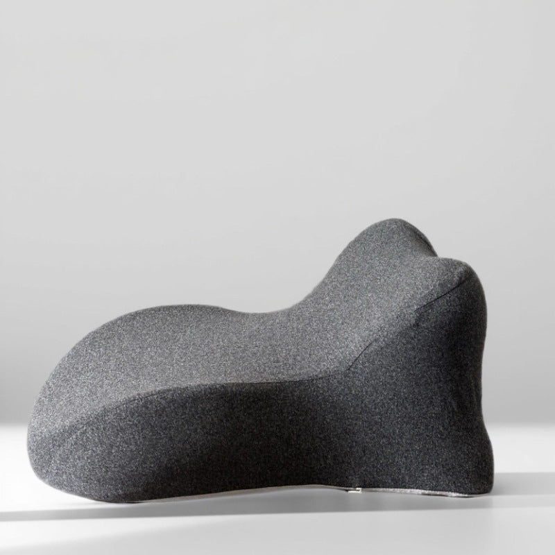 Deep gray back cushion shown without the neck roll, bare valley at the upper edge