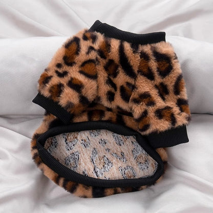 Leopard print plush fleece dog sweater with ribbed black collar and cuffs