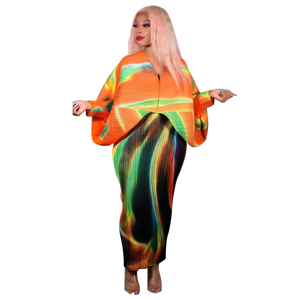 Free size pleated batwing midi dress with bold abstract print on a model, close print detail
