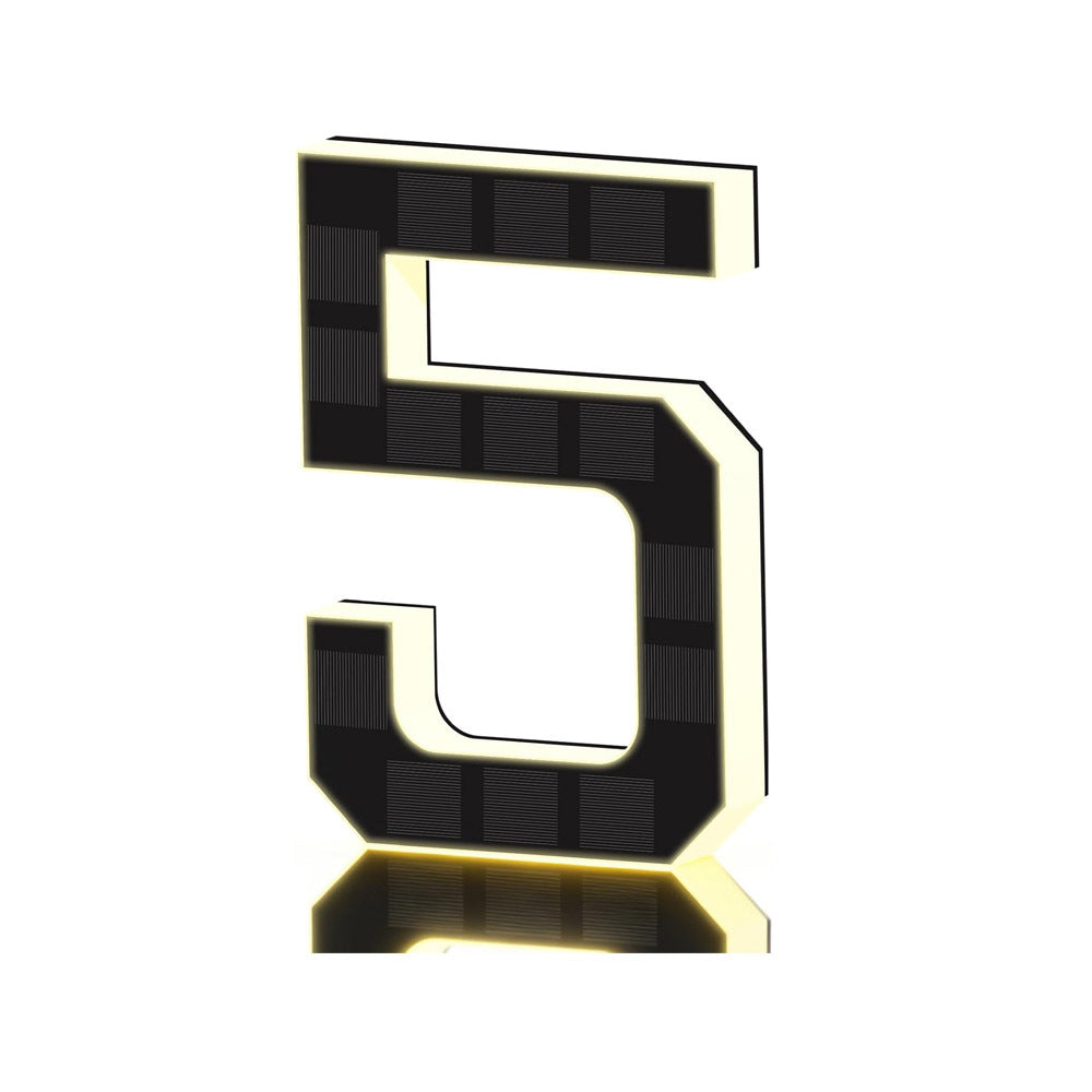 Black and gold solar LED house number sign, one character with a backlit warm outline, angled view