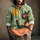Man wearing a sage green hooded henley shirt with a cat in sunglasses and an orange sun print