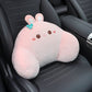 Pink rabbit lumbar support pillow with a teal bow resting on a black car seat