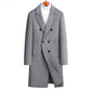 Gray double breasted wool blend coat on a wooden hanger over a white roll neck, front view