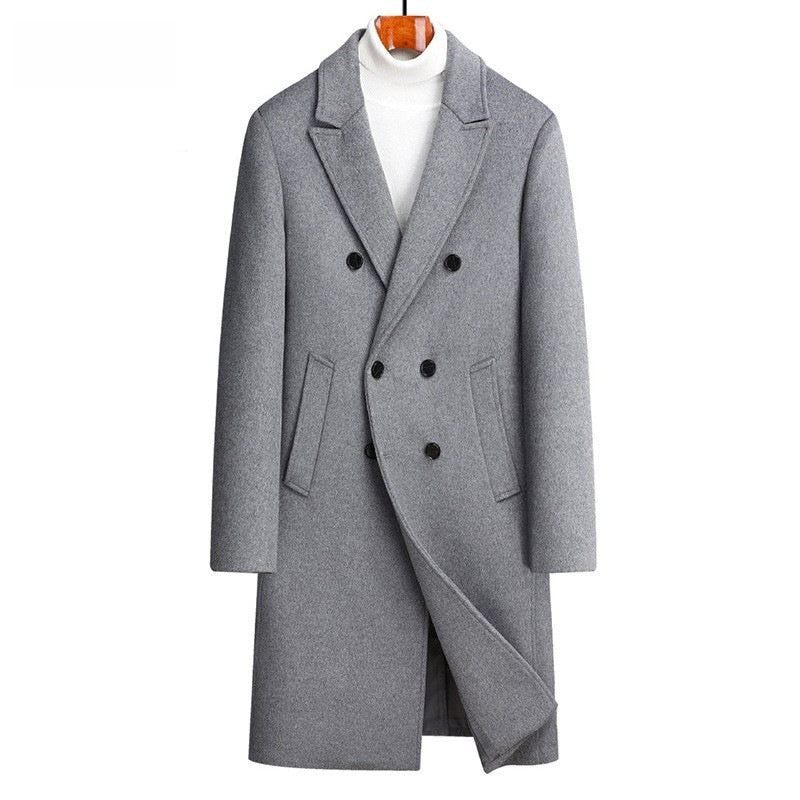 Gray double breasted wool blend coat on a wooden hanger over a white roll neck, front view