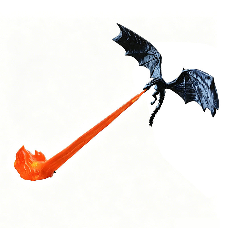 Compact black dragon figurine over a shorter sculpted flame stand on a desk