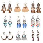 Bohemian vintage clip-on tassel drop earrings on a zinc alloy frame, handmade boho pair on white studio background
