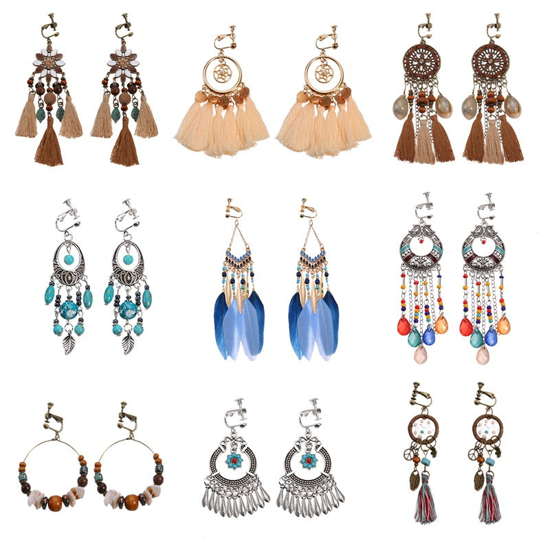 Bohemian vintage clip-on tassel drop earrings on a zinc alloy frame, handmade boho pair on white studio background