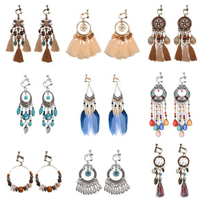 Bohemian vintage clip-on tassel drop earrings on a zinc alloy frame, handmade boho pair on white studio background