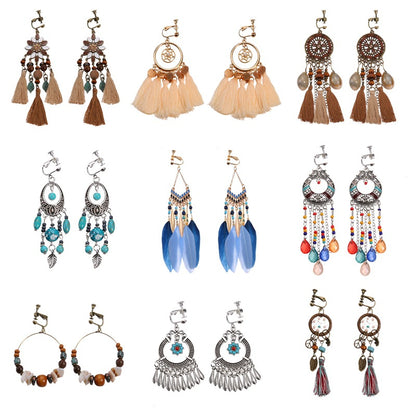 Bohemian vintage clip-on tassel drop earrings on a zinc alloy frame, handmade boho pair on white studio background
