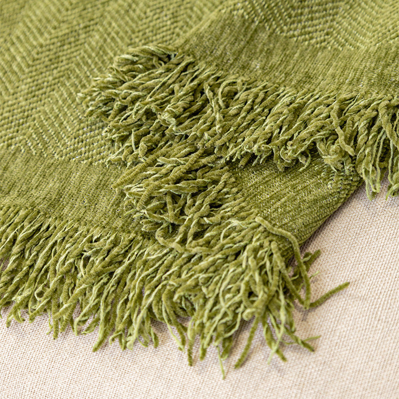 Chenille sofa cover in a solid color folded to show its thickness