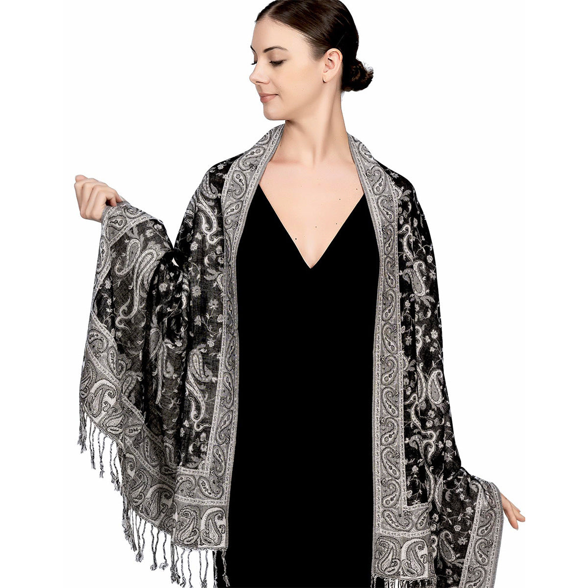 Black and white paisley tassel shawl wrap shown spread flat with tasseled fringe ends
