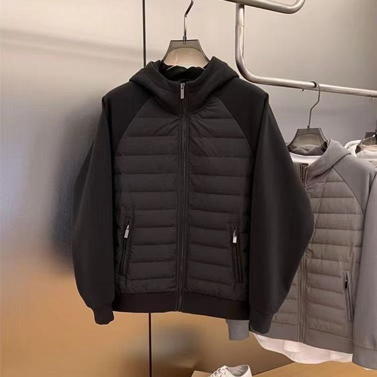 Straight ribbed hem and lower zip of the padded hooded casual jacket