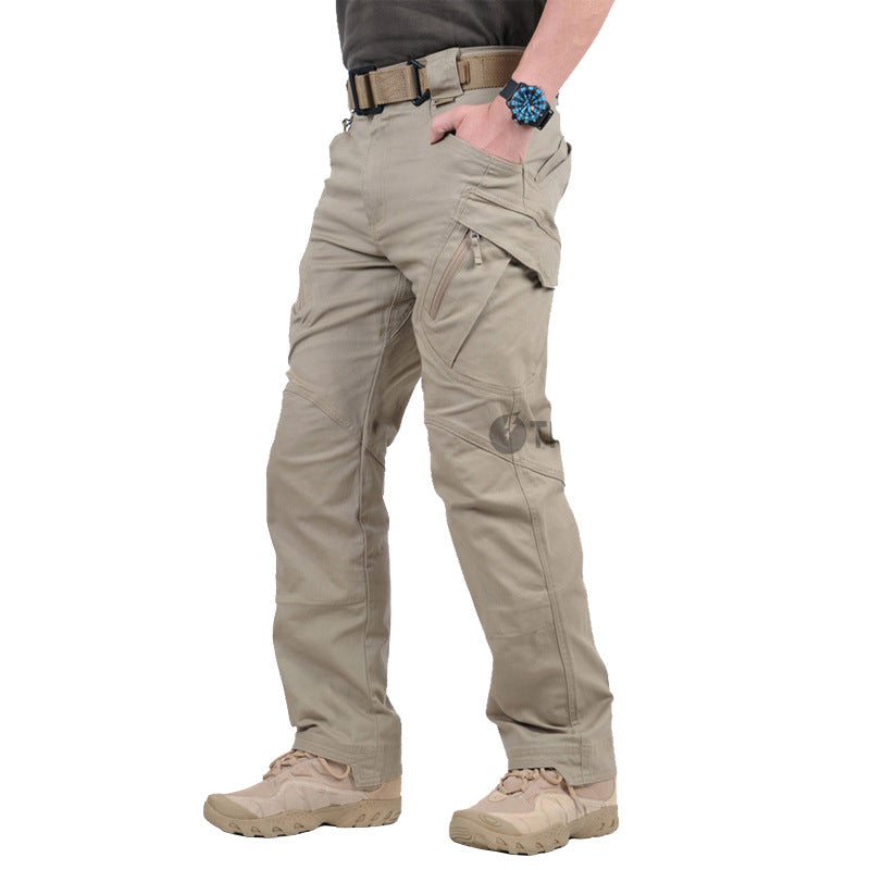 Khaki tactical cargo pants worn side view showing zip flap thigh pocket and knee panels