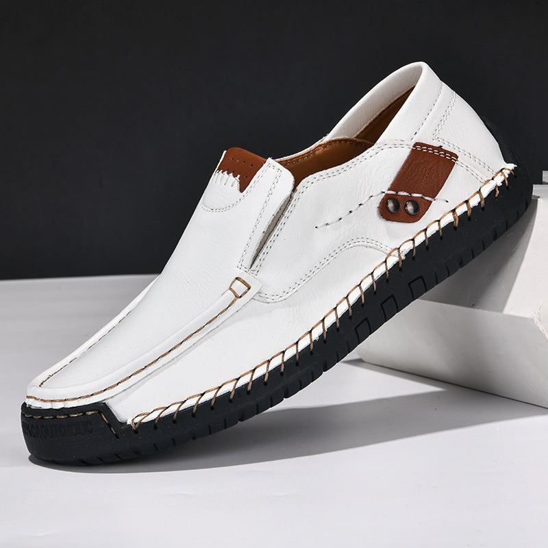 Mens cowhide leather loafer with a soft sheen and a low rubber sole, studio shot