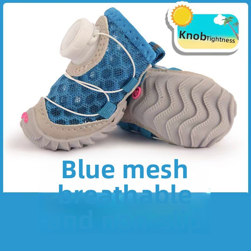 Blue mesh dog shoe with a twist knob and grey wavy rubber sole shown from the side