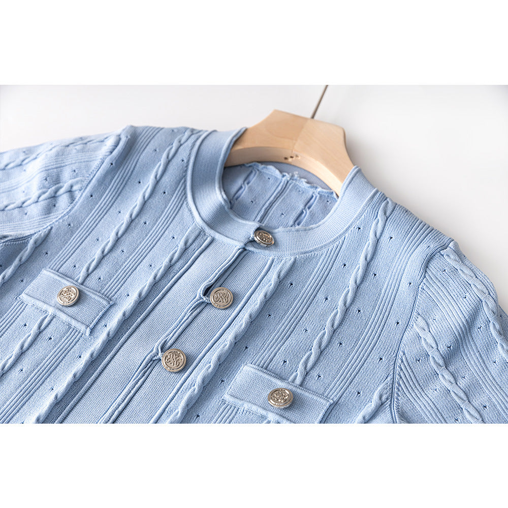 Close up of light blue dress fabric and ruffled sleeve detail